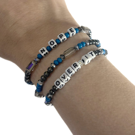 NOPE + OVER IT Bracelet Stack – Hematite & Blue Glass Beads | Hope & Hustle Co.