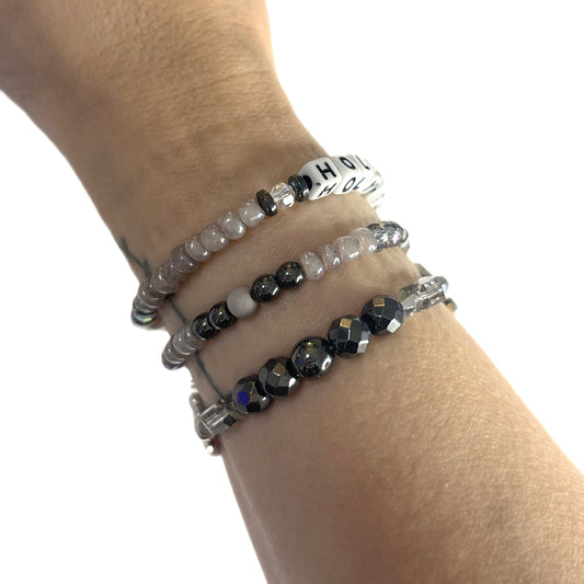 HOLY-ISH Bracelet Stack – Hematite & Gray Glass Beaded Cross Set | Hope & Hustle Co.
