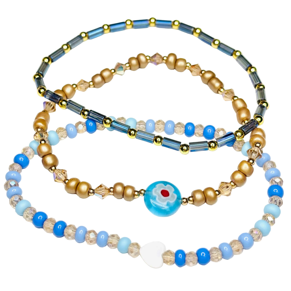 Blue and gold beaded bracelet stack with Austrian crystal accents, 14k gold-plated details and shell heart