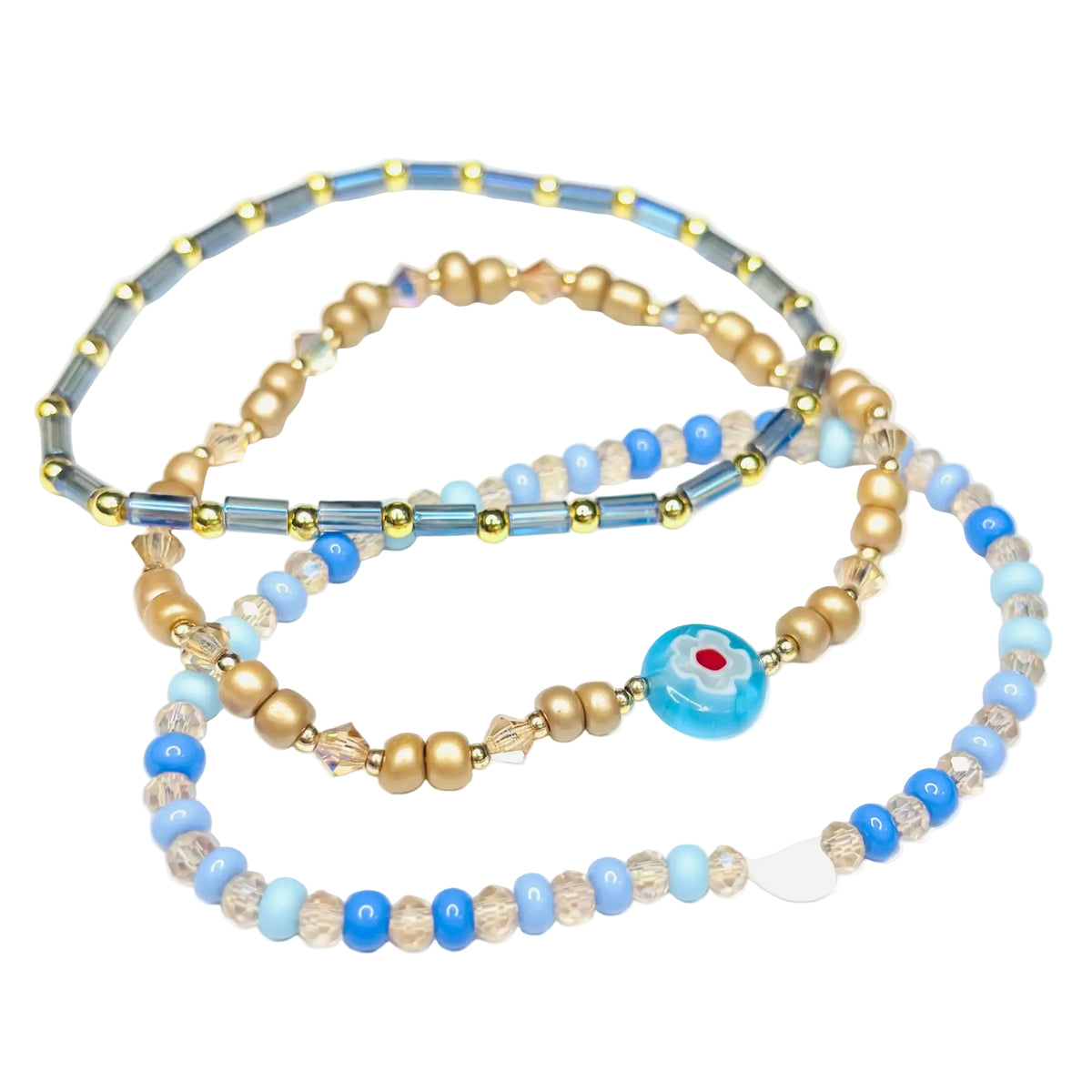 Handmade blue and gold 3-piece stretch bracelet set with glass beads, Austrian crystal accents and white shell heart